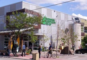 Sunny day outside a corner shot of the exterior of Mountain Equipment Co-op in Ottawa