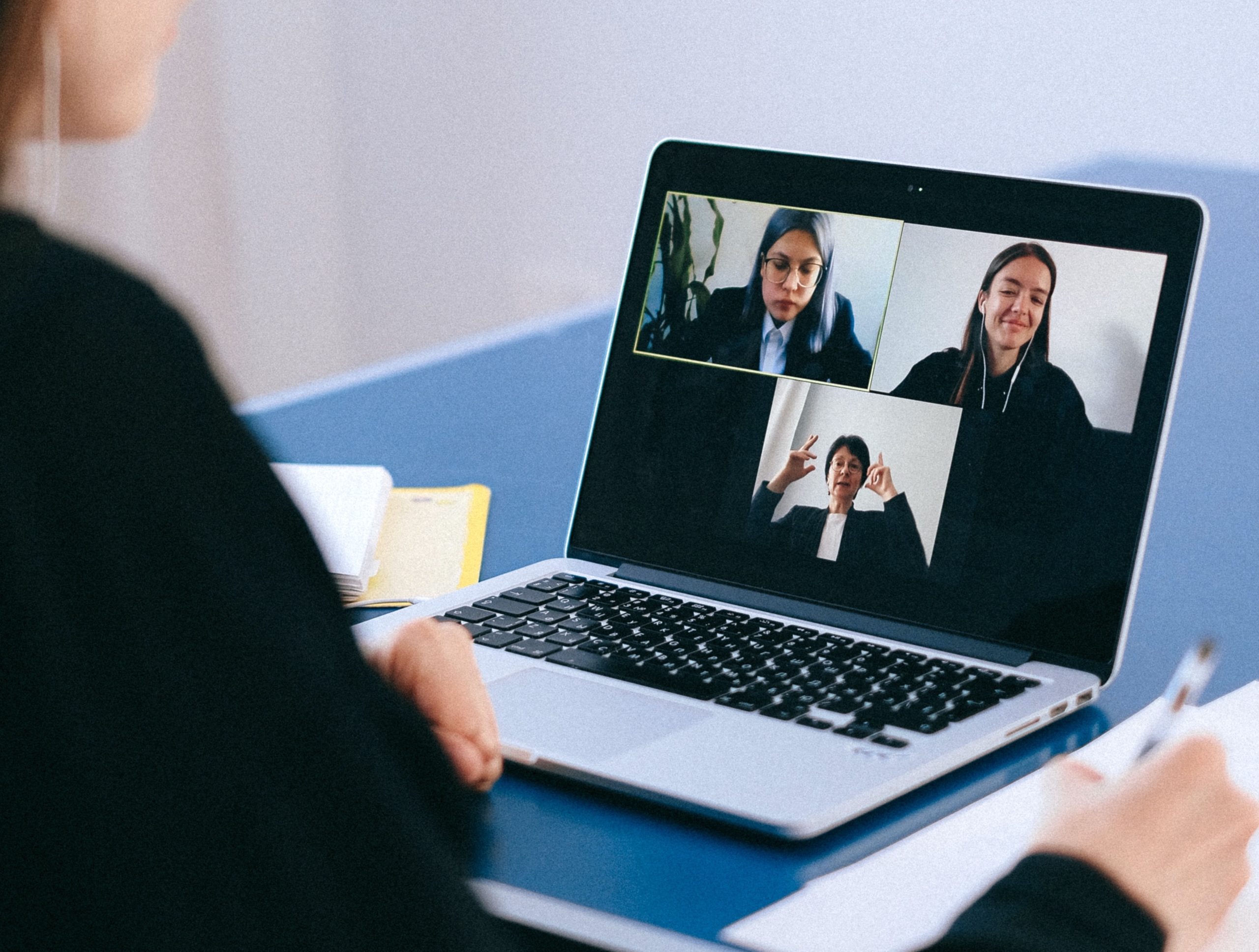 Image of someone presenting online from their laptop. 