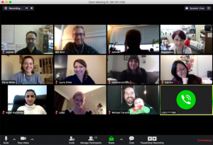 A screenshot of 12 people video chatting over Zoom
