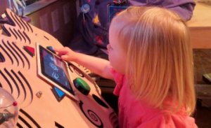 A child playing a game that measures her sustained attention