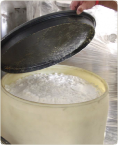 Methamphetamine in a powdery form inside of a container.