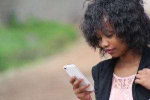 A woman looking at her phone.