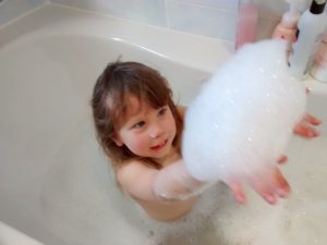 A child in a bathtub.