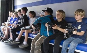 A group of boys playing video sports.