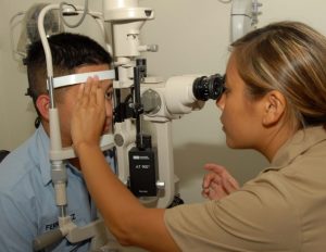 A child receiving an eye exam.
