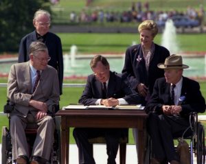 President George H. W. Bush Signs the Americans with Disabilities Act, 07/26/1990.