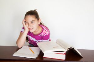 If this girl thinks that studying won’t help her do well on the test, her low self-efficacy may develop into learned helplessness.