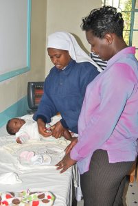 A nurse giving an infant vaccinations.