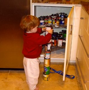 A boy stacking cans.
