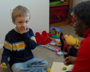 A boy with ASD receiving therapy.