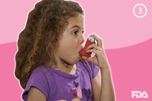 A child using an inhaler to control asthma.