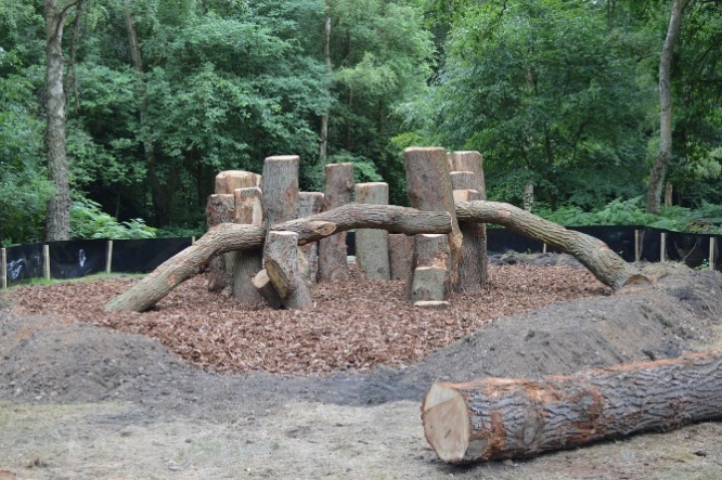 Adventure playground example: logs arranged for climbing.