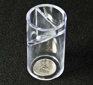 Plastic tube slightly larger than a quarter, used to check for choking hazards.