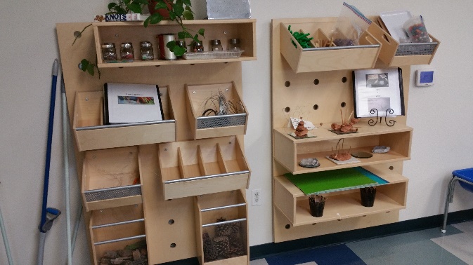 These shelves are in a classroom for 3-year-olds. What adjustments might need to be made to meet the needs of the children and keep them safe?