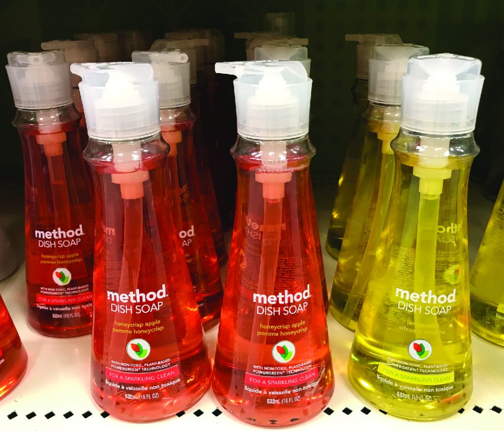 A retail shelf holding bottles of dish soap.