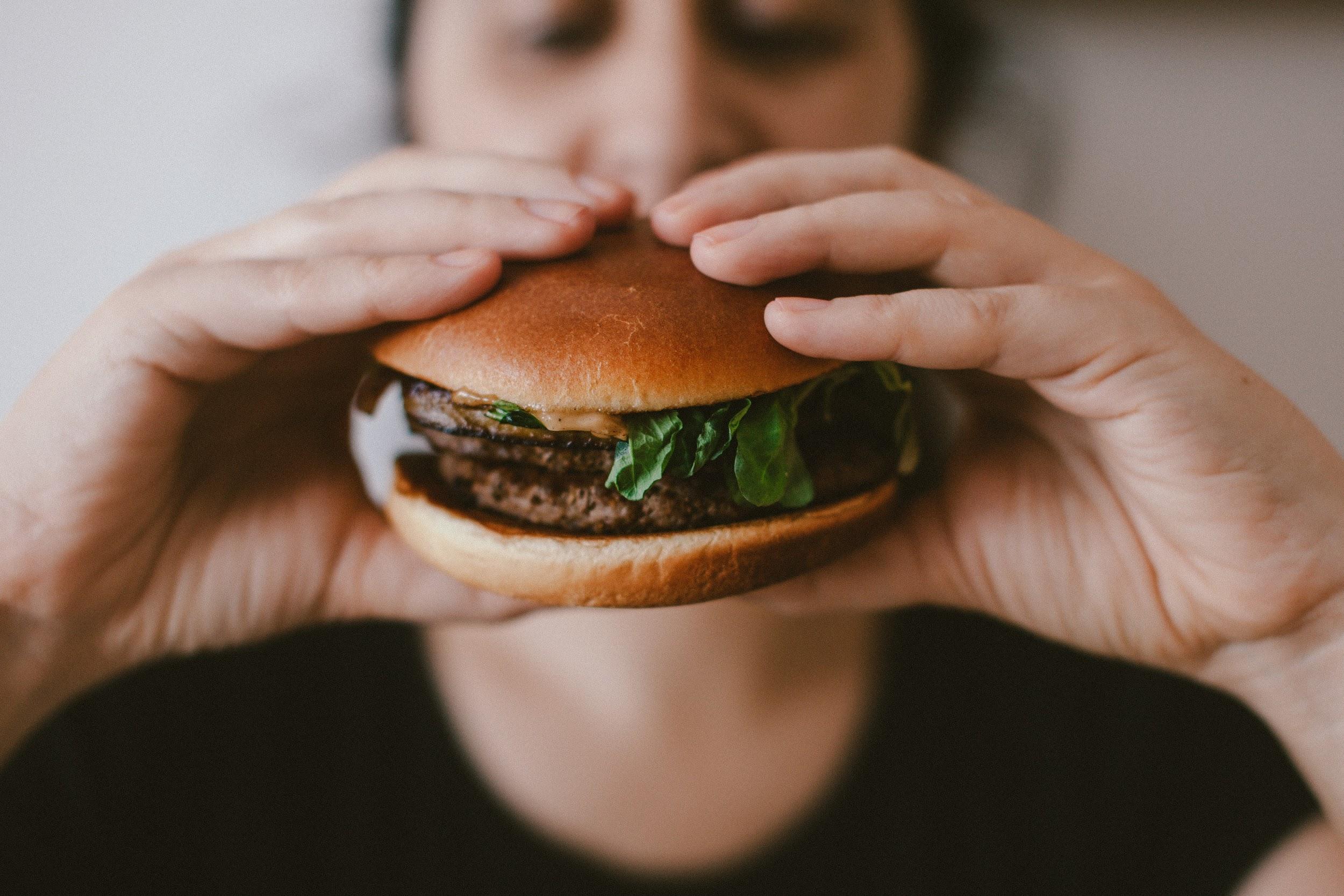 Person eating a burger