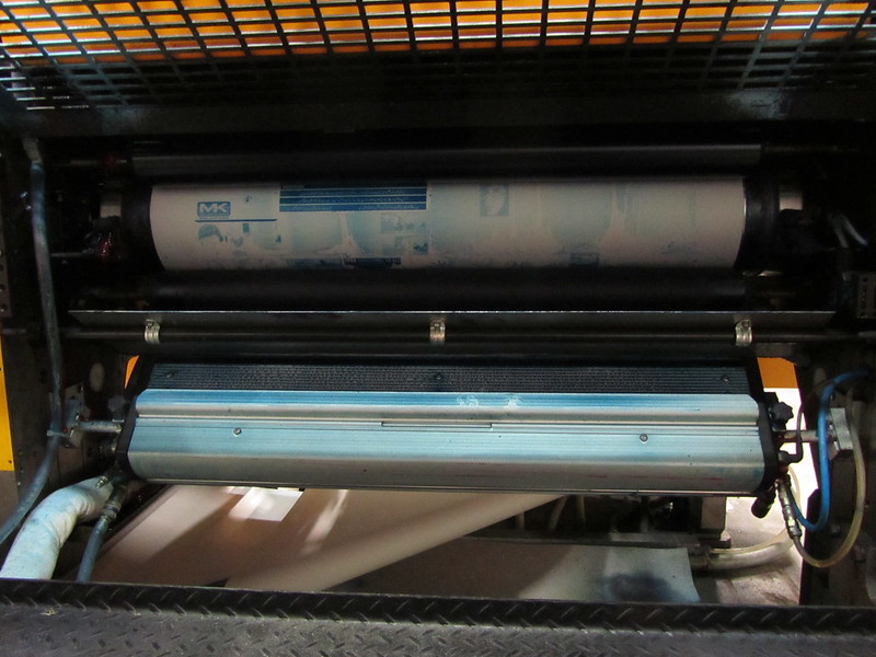 An industrial printing press in action