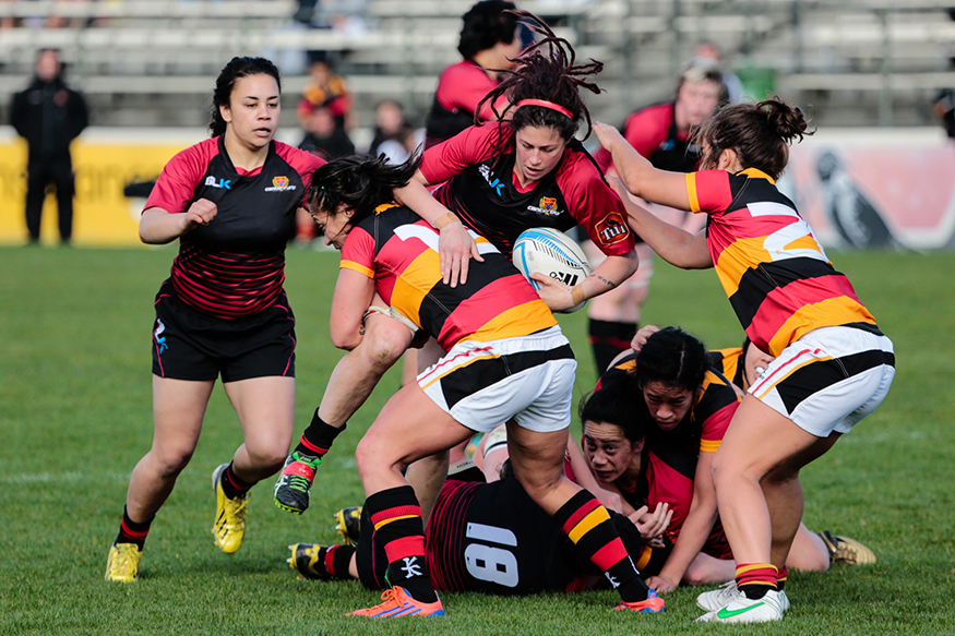 Rugby players colliding during a rugby match.