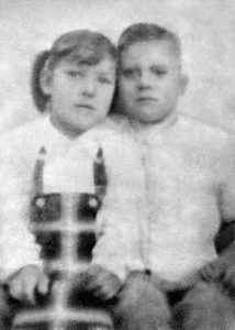 A faded black and white photo of Shirley age 5 and Ike age 6