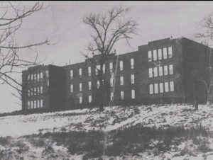 Shubenacadie Residential School in winter with light dusting of snow