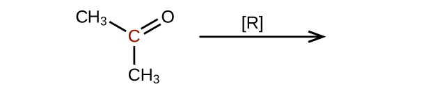 The left side of a reaction and arrow are shown. The arrow is labeled with an R in brackets. To the left of the arrow is a molecular structure that shows a central, red C atom. This C atom is bonded to 2 C H subscript 3 groups, and it forms a double bond with an O atom.