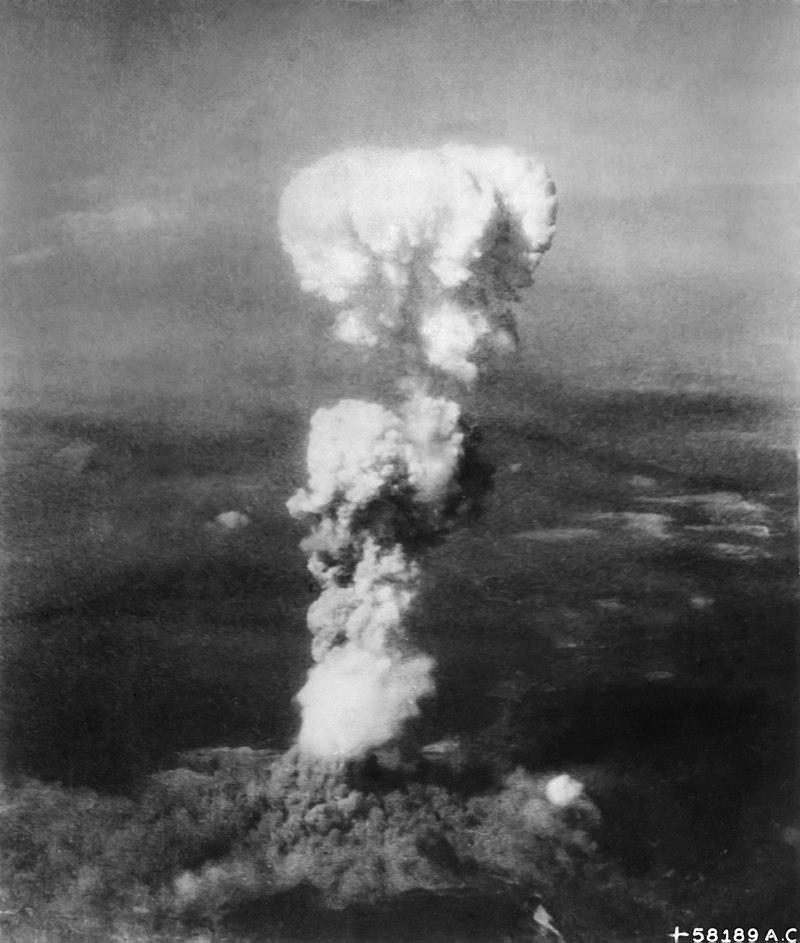 The mushroom cloud rising over Hiroshima during the nuclear attack.
