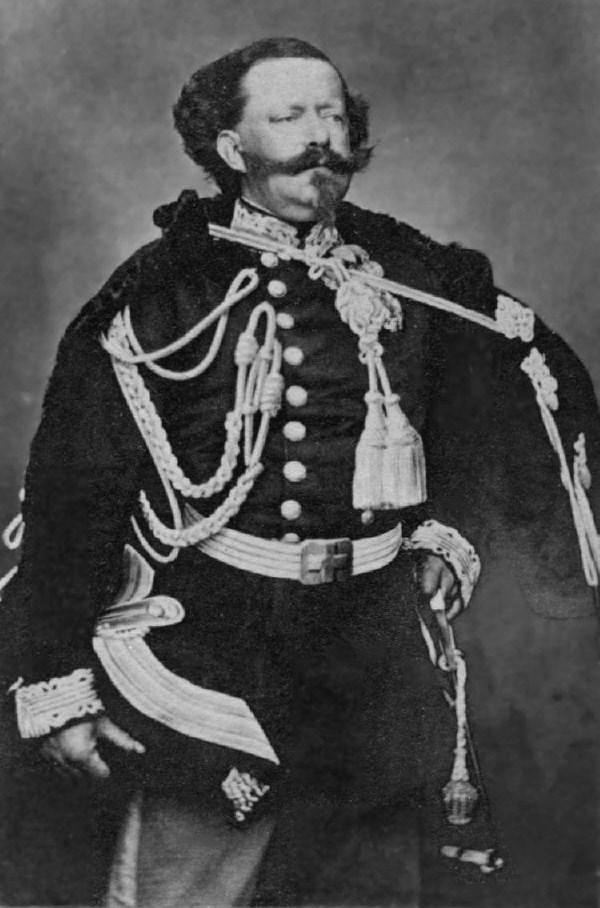 Photograph of Victor Emmanuel II. His mustache extends horizontally beyond his cheeks.