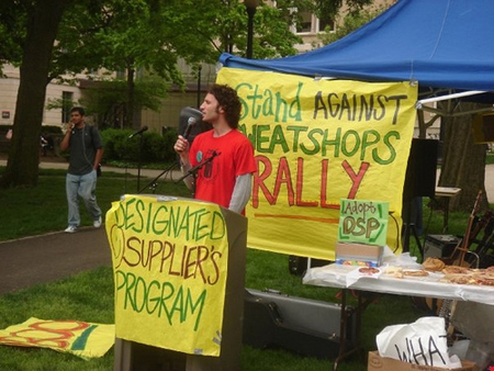 A protester giving a speech protesting sweatshops.