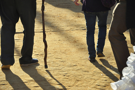 A man walking with a cane.