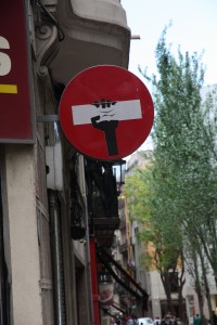 A sign with a large rectangle. A hand was drawn on to look like it holds the rectangle like a brick.